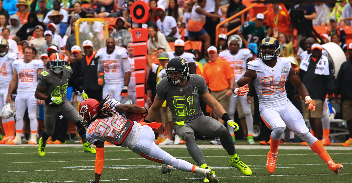 Dexter McCluster second from left punt returner for the Kansas City Chiefs evades a tackle by Paul Posluszny inside linebacker for the Jacksonville Jaguars during the 2014 National Football League Pro Bowl at the Aloha Stadium Hawaii Jan 26 2014