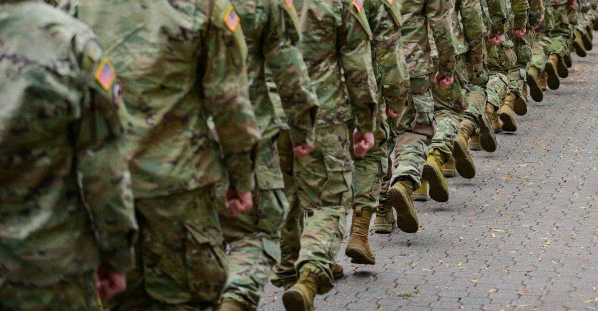 A procession of soldiers marches during a patriotic celebration at Fort Bragg, NC.