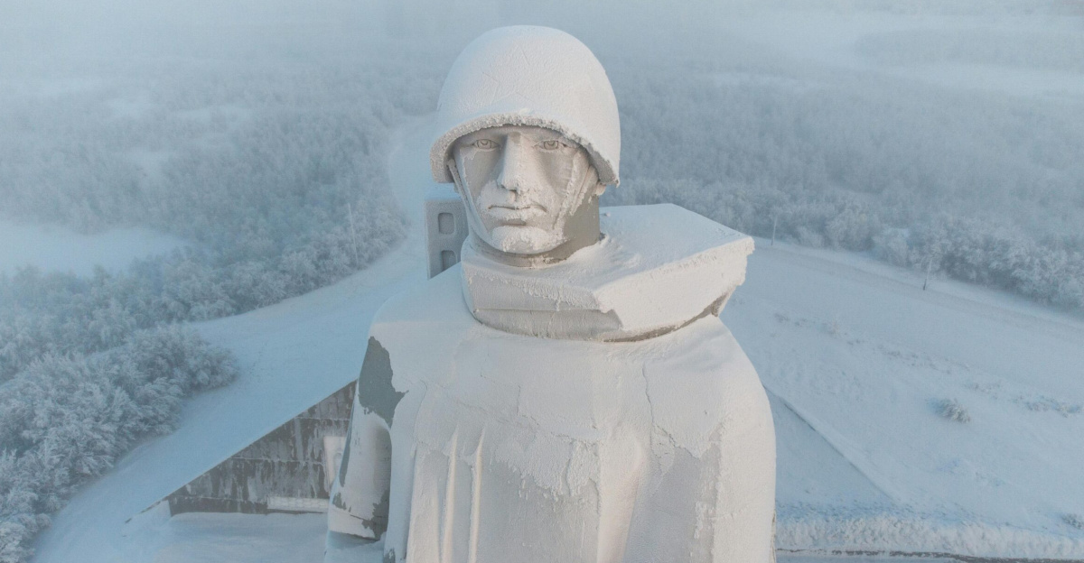 Aerial view of the snow-covered Alyosha monument in Murmansk during winter.
