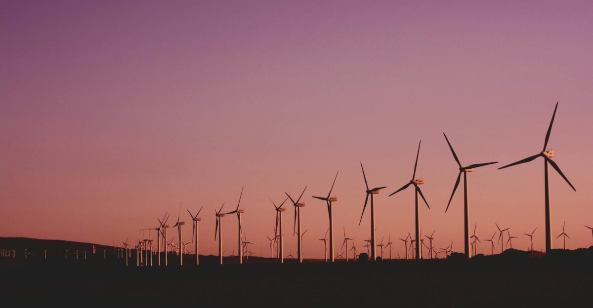 Silhouetted wind turbines at sunset in Zahara de los Atunes Spain