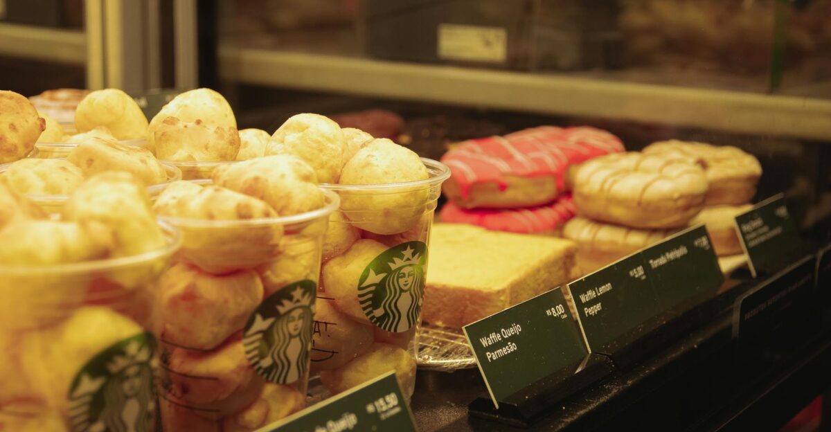 A close-up view of various pastries and baked goods on display in a caf setting