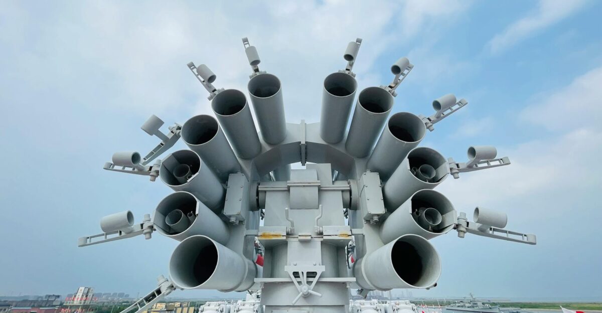 Close-up of naval artillery on a warship at Tianjin Harbour China showcasing military might