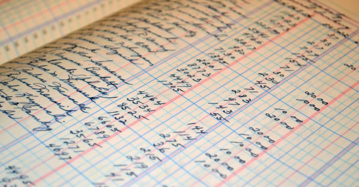 Close-up of a vintage handwritten ledger detailing financial records and accounts