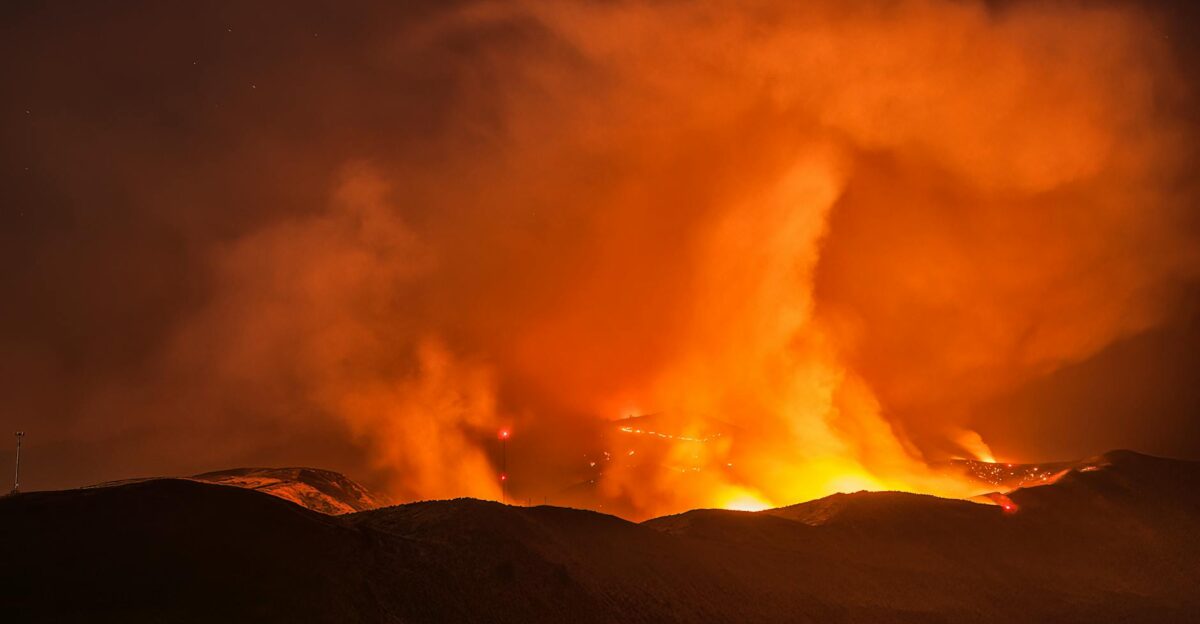 Intense wildfire burning at night in Wenatchee WA Captivating flames and smoke