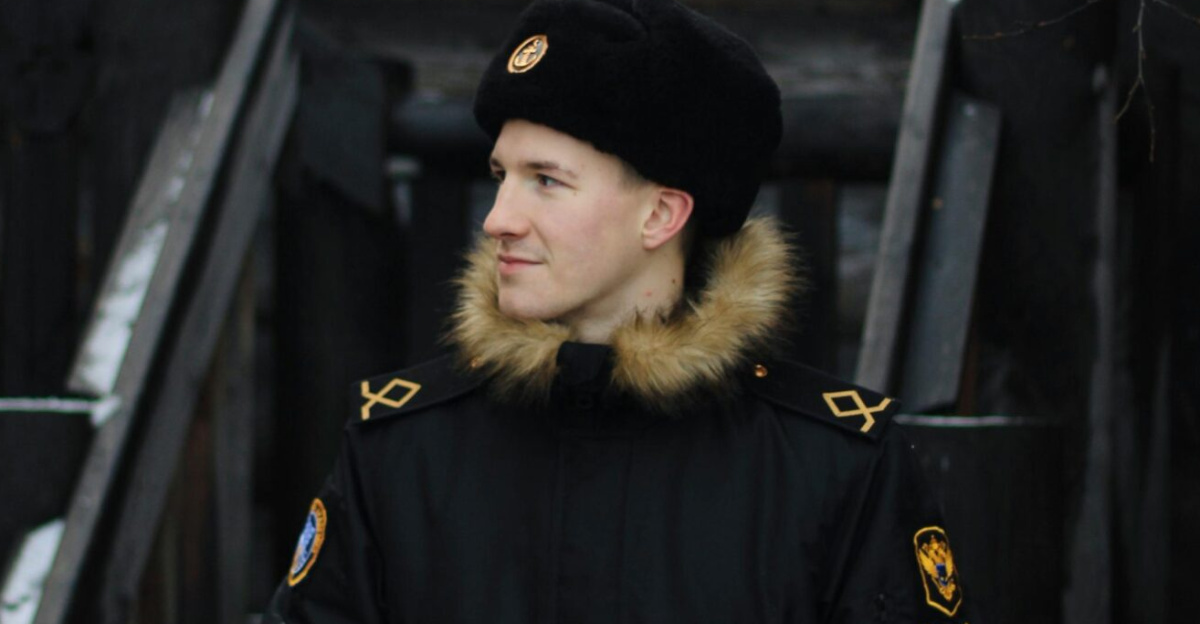 Man in a fur-lined coat and hat standing outdoors in winter, Murmansk.