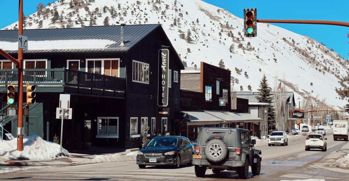 Charming winter day in Jackson WY showcasing snow-covered streets hotel and mountains