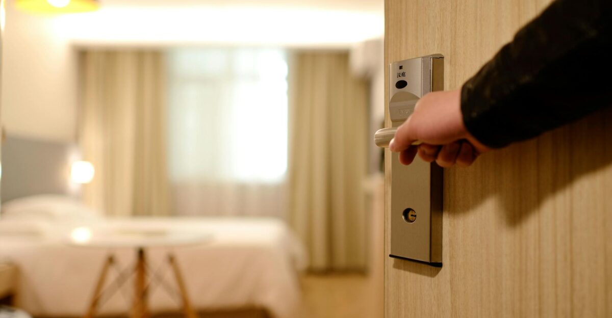 A soft-lit hotel room entrance welcoming guests with luxury appeal and comfort