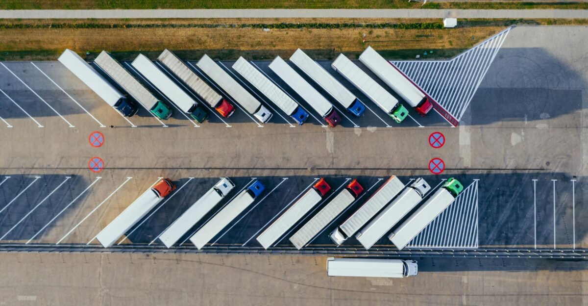 Overhead shot of semi-trucks parked in Pozna Poland demonstrating transportation logistics