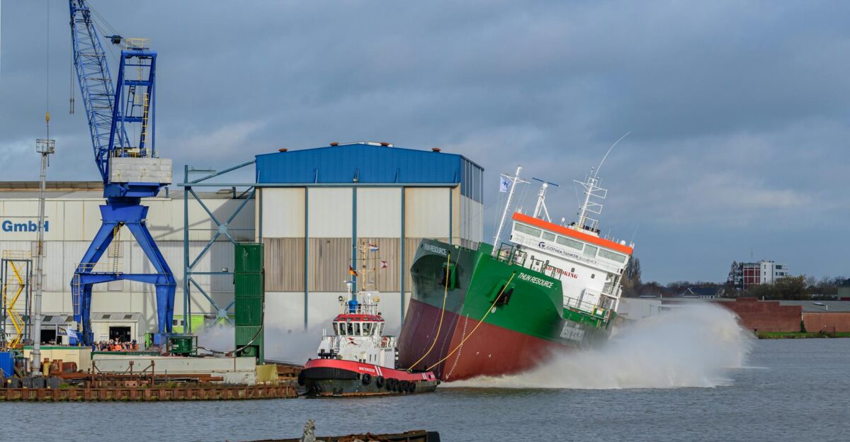 Dramatic ship launch with tugboat at Niedersachsen port Germany
