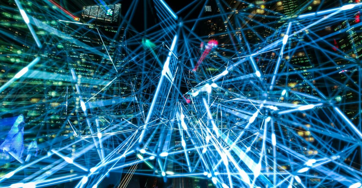 Dynamic urban scene showcasing interconnected light trails representing digital communication networks