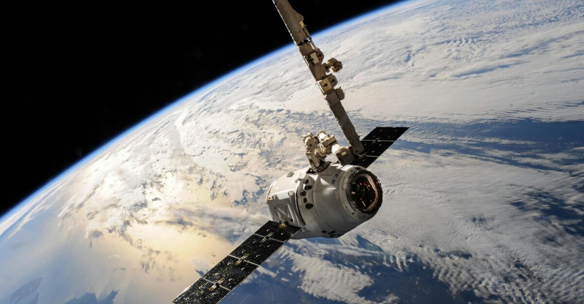 A satellite glides over Earth showcasing dramatic cloud formations and the vast expanse of space