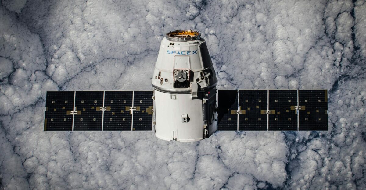 SpaceX Dragon spacecraft in orbit highlighting advanced space technology with cloud backdrop