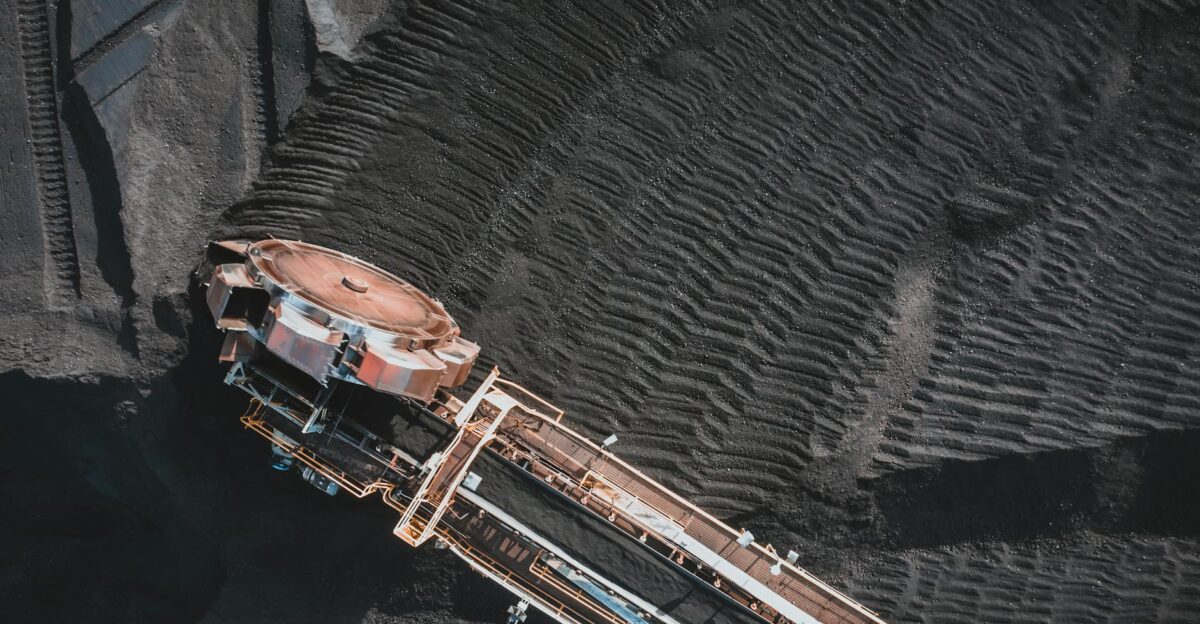 Aerial view of an industrial conveyor system at a coal mining site showcasing engineering and machinery
