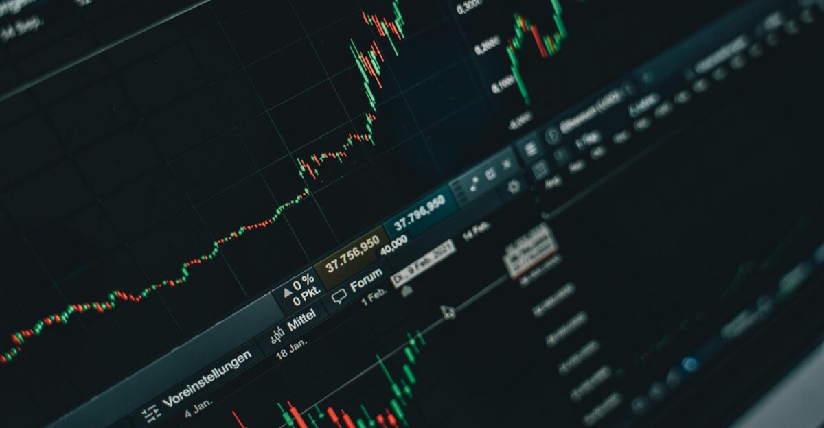 Close-up of stock market trading screen displaying financial growth and charts