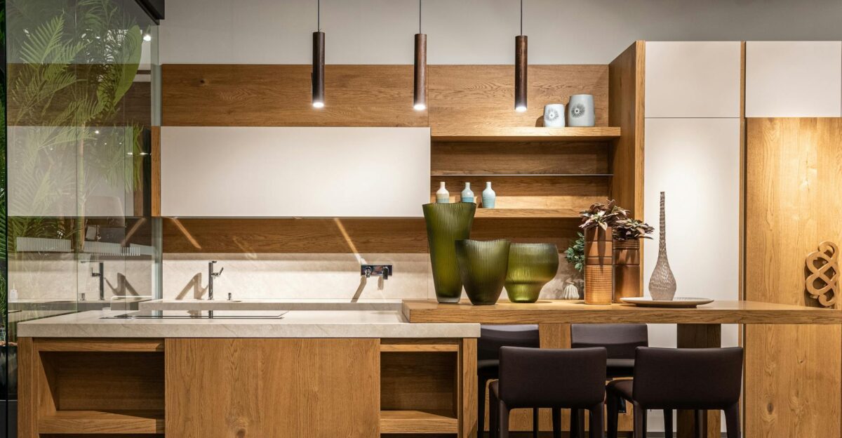 Explore this elegant modern kitchen featuring wooden cabinets and minimalist decor