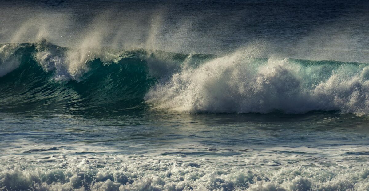 Dramatic ocean waves crashing with a splash showcasing the power and beauty of the sea
