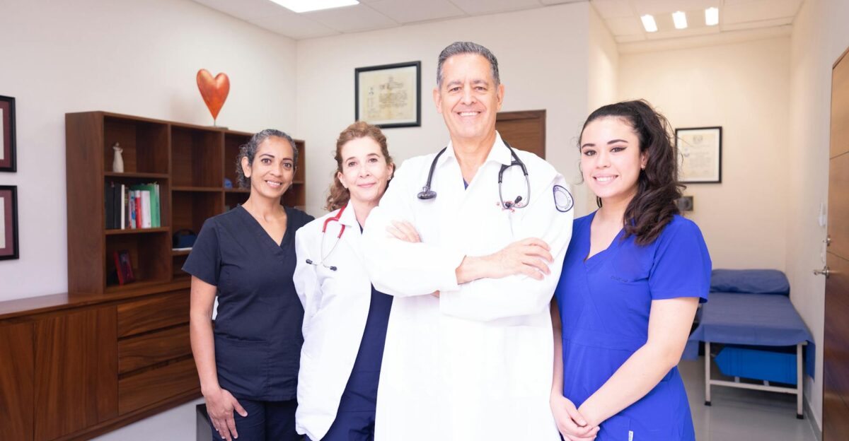 Group of diverse healthcare professionals in a clinical setting showcasing teamwork and care