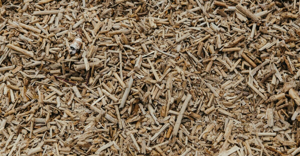 Close-up view of a textured surface of natural brown wood chips ideal for organic and environmental themes