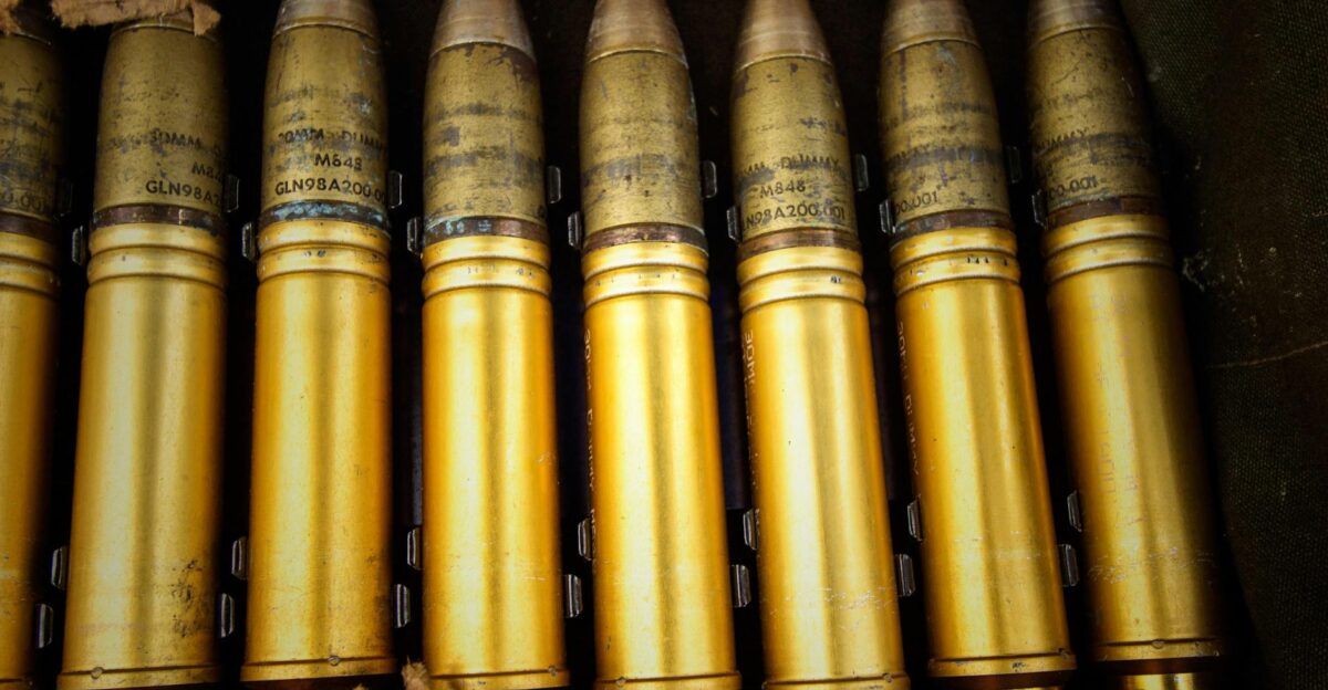 Detailed shot of brass ammunition in a military storage box