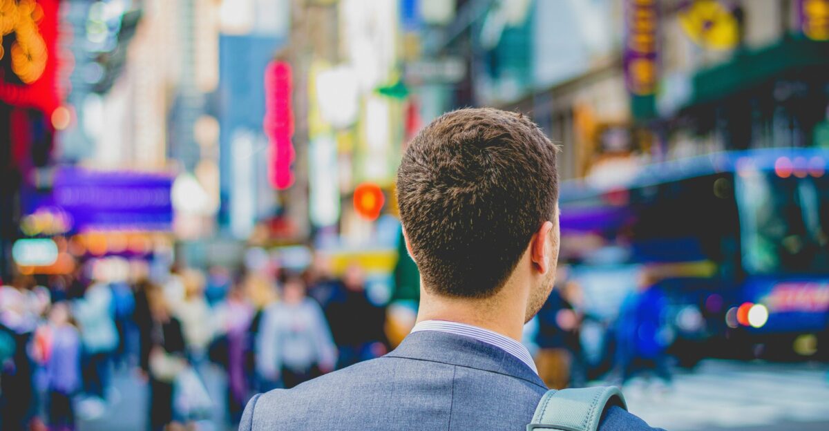 shallow focus photography of man in suit jacket s back