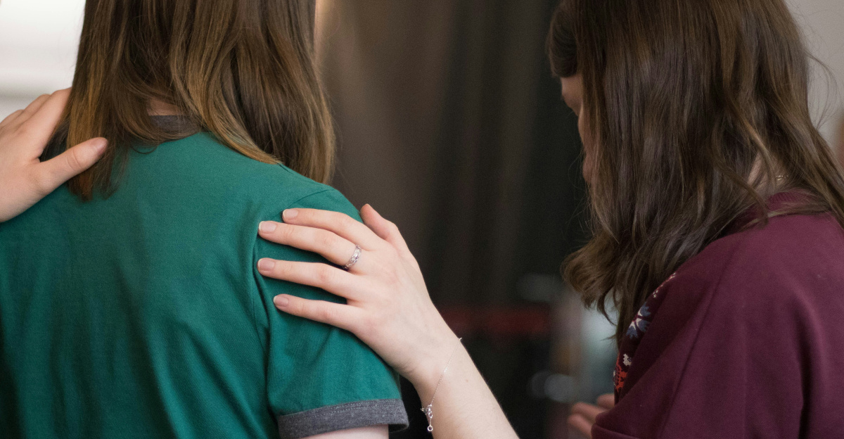 four women looking down