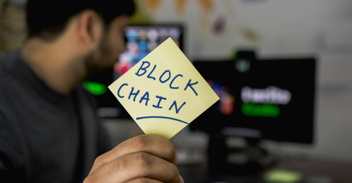 person holding sticky note