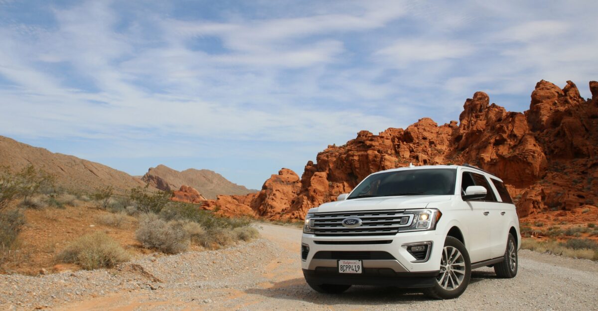 parked white Ford Explorer SUV