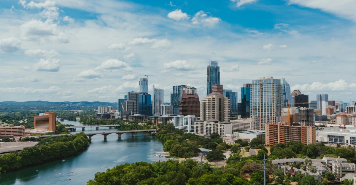 river near buildings during daytime