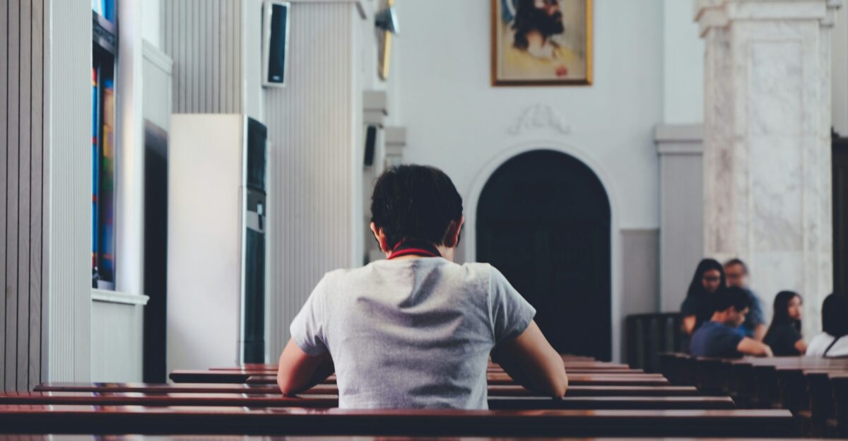 person praying inside church