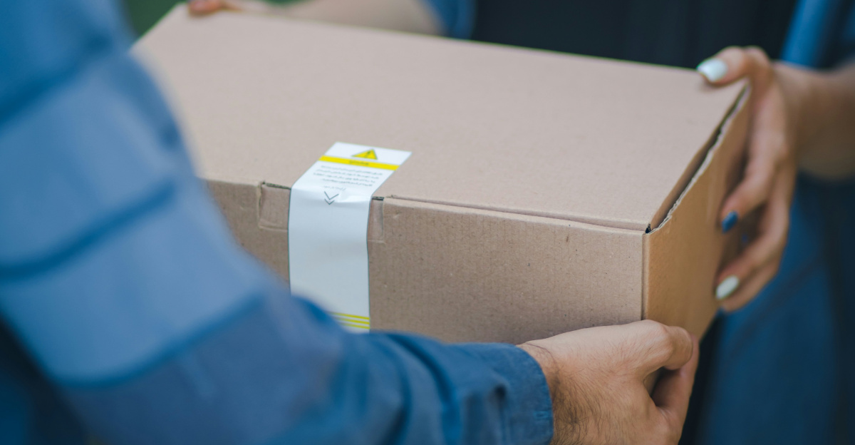 person giving brown box