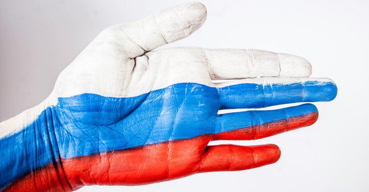 persons hand with blue paint