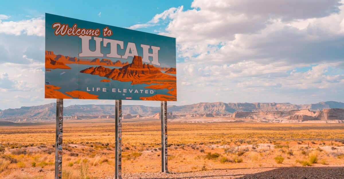 a welcome to utah sign in the desert