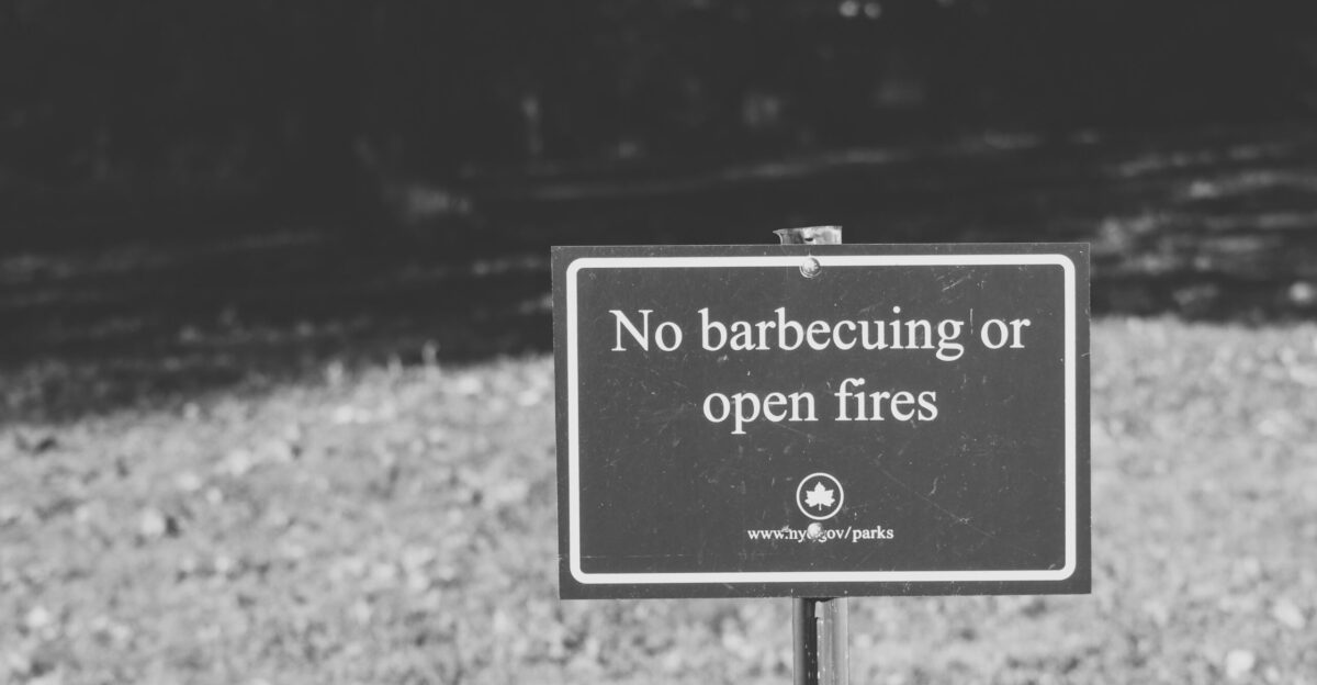 grayscale photo of no smoking sign