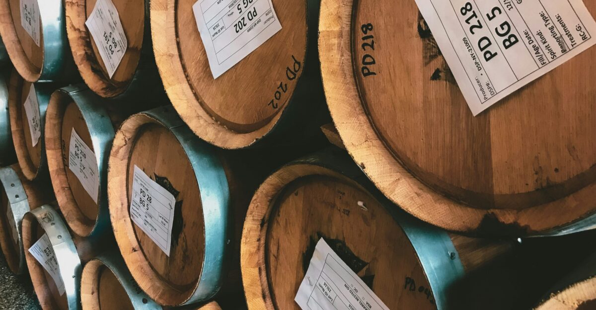 brown wooden barrels with white printer paper