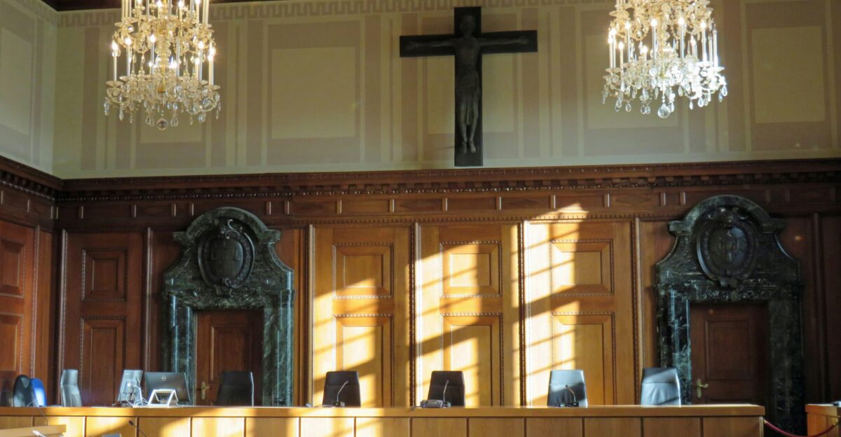 black cross on brown wooden table