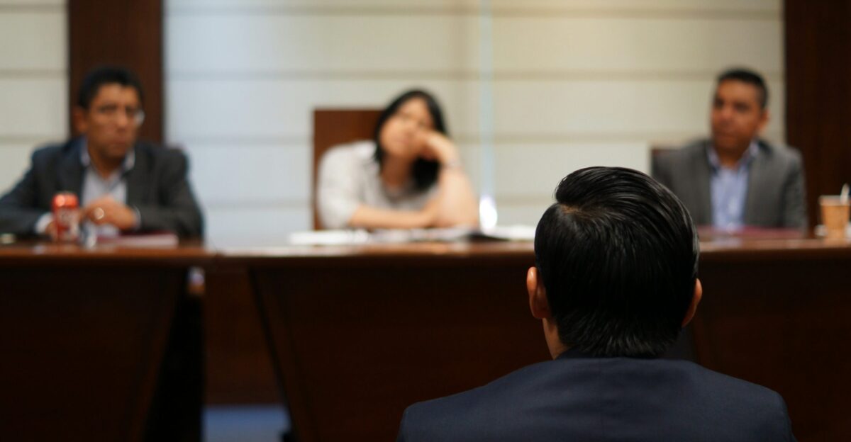 man in black shirt sitting beside woman in white shirt