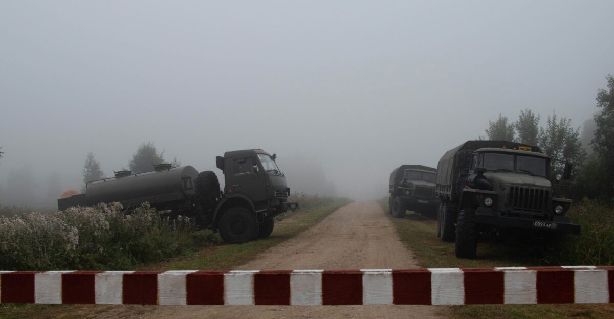 black suv on brown and white brick pathway during daytime
