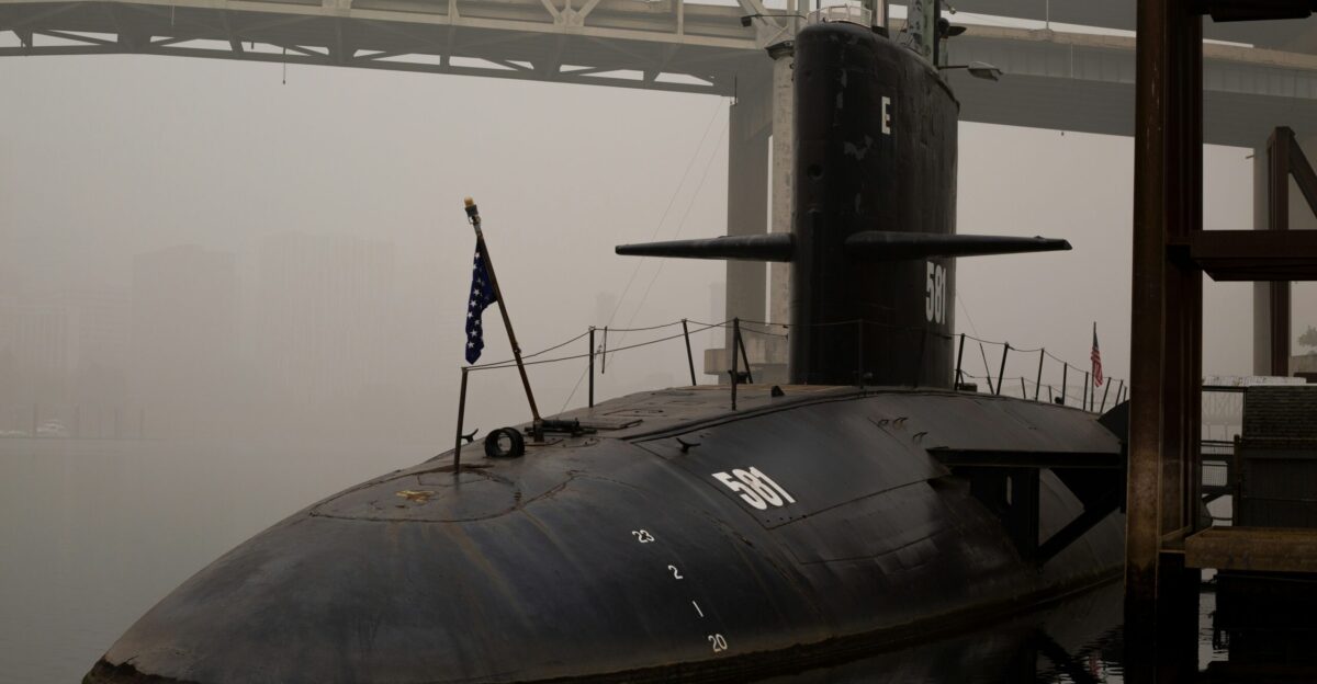 black ship on sea during daytime