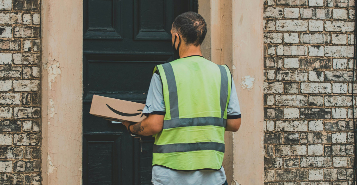 man in green and yellow striped shirt holding black smartphone