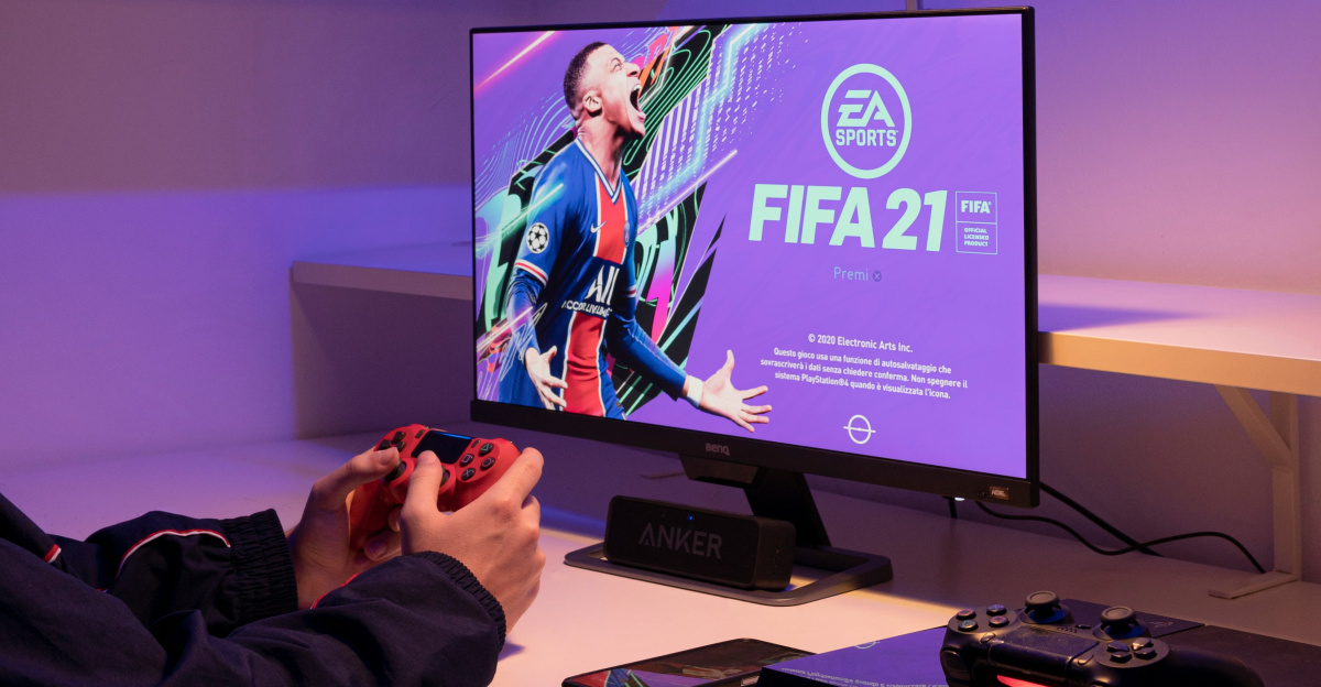 black flat screen tv turned on near black remote control