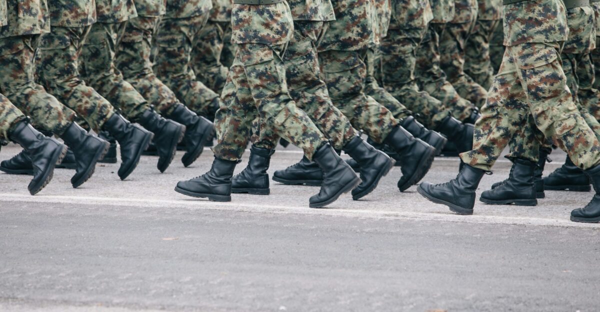 men in green and brown camouflage uniform