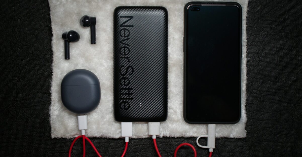 black iphone 5 c beside white usb cable