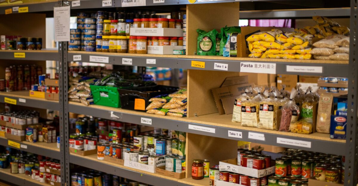 green and white labeled plastic bottle on brown wooden shelf