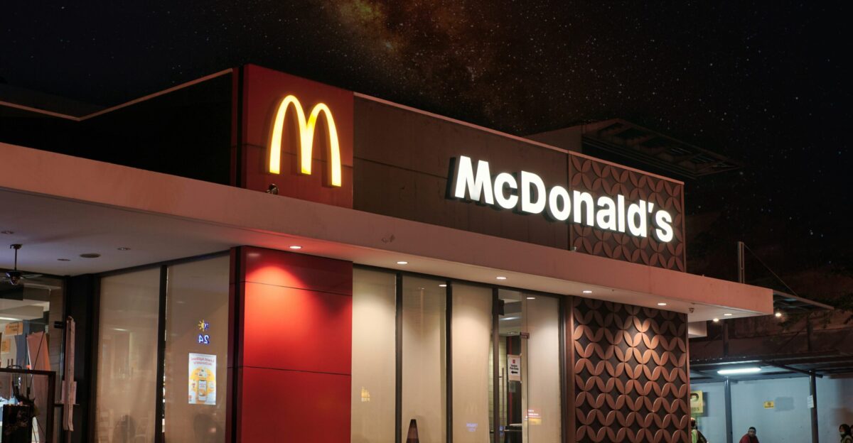 a mcdonald s restaurant is lit up at night