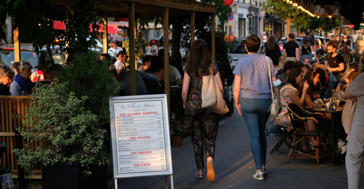 people standing near green trees during daytime