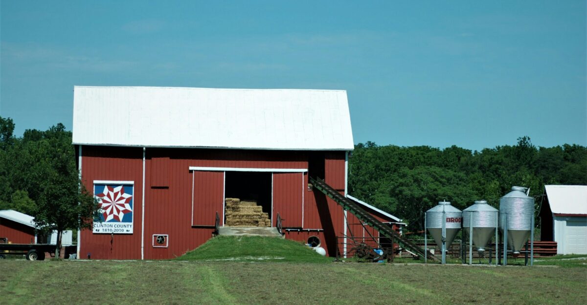 red and white barn under blue sky during daytime