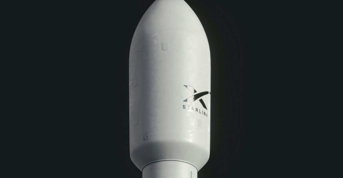 a close up of a white rocket on a black background