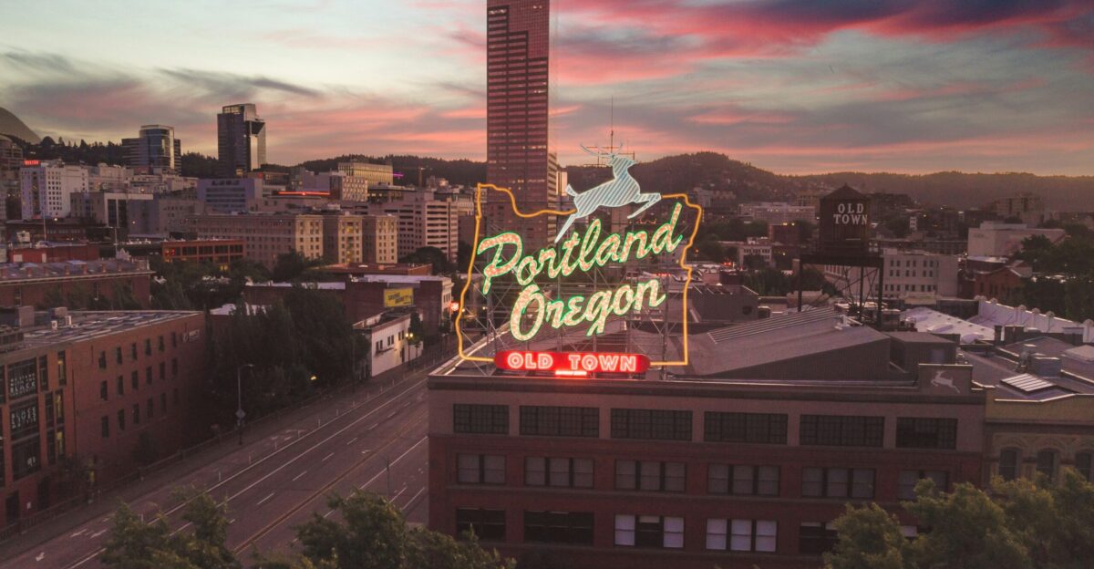 a large neon sign on top of a building