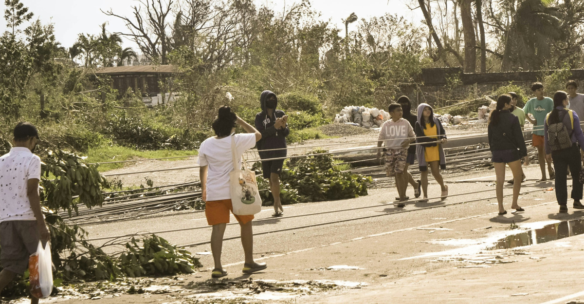 a group of people walking down a street