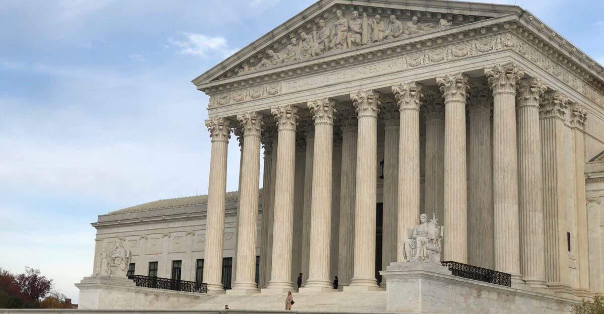 a large white building with columns and pillars